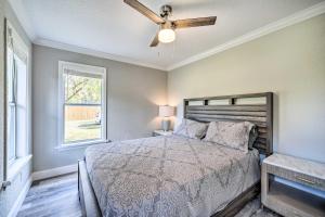 a bedroom with a bed and a ceiling fan at Apopka Home with Yard and Grill Near Wekiwa Springs! in Apopka
