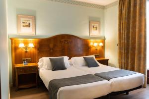 Кровать или кровати в номере Hotel Alda Mercado de Zamora