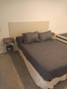 Кровать или кровати в номере Monoambiente con Patio Exelente ubicación en el Centro