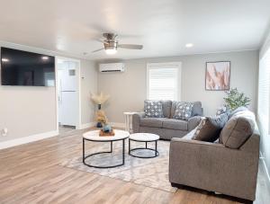 a living room with two couches and a table at Country Living-harrison Ranchhr3 in Visalia