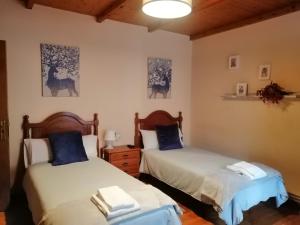 A bed or beds in a room at Casa Licerio