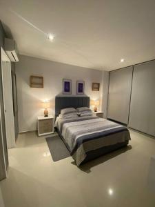 Cama o camas de una habitación en Apartamento en Condominio con Salida al Mar MORROS EPIC