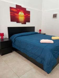 Posteľ alebo postele v izbe v ubytovaní La Maison di Angela