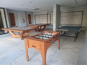 three ping pong tables in a room with at Salinas Premium Resort 1423 Smart in Salinópolis