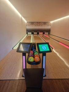 a bowling alley with a bowl of fruit in the lanes at Salinas Premium Resort 1423 Smart in Salinópolis
