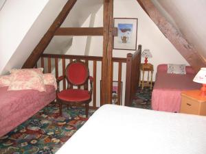 Llit o llits en una habitació de Les Granges Du Bout De La Ville