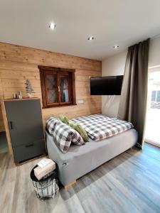 A bed or beds in a room at DaHome Appartements