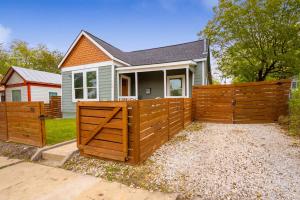 a wooden fence in front of a house at Modern 3 Bed, 2 Bath Home Minutes to Downtown & Alamodome in San Antonio