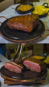 a plate of food with a piece of meat on it at Marruá Hotel in Bonito