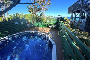 a hot tub on a deck next to a bench at Restoration Sands in Stuart