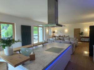 a kitchen and living room with a counter top at Sprungschanze Haus in Murau