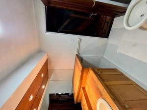 a small bathroom with a sink and a mirror at Casita de Villegas in San Martín de los Andes