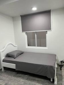 Ein Bett oder Betten in einem Zimmer der Unterkunft Hermoso Hospedaje Palmira