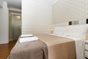 Tempat tidur dalam kamar di Apartamento confortável e bem decorado a poucos passos da Beiramar Norte P1925