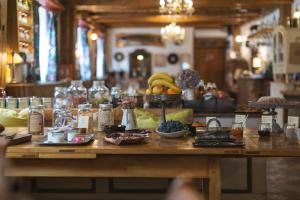 a table with a bunch of fruit on it at Guesthouse Novak in Dvor