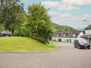 a car parked on the side of a street at Beechwood in Arrochar