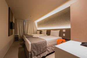 Postel nebo postele na pokoji v ubytování Saint Patrick Grand Hotel