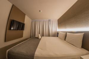 Postel nebo postele na pokoji v ubytování Saint Patrick Grand Hotel