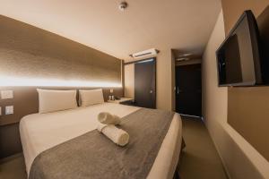 TV a/nebo společenská místnost v ubytování Saint Patrick Grand Hotel