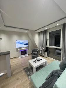 Sjónvarps- og/eða afþreyingartæki á Apartman Dora