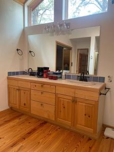 a bathroom with a large sink and a mirror at Monroe’s Chateau with Hot Tub in Angel Fire