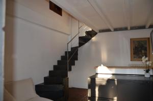a living room with a staircase and a couch at Le Tre Valli in Sora
