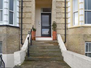 a stairway leading to a house with a door at Flat 2 Beachview - Ukc4220 in Lowestoft