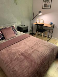 Posteľ alebo postele v izbe v ubytovaní Moderno Apartament