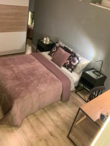 Posteľ alebo postele v izbe v ubytovaní Moderno Apartament