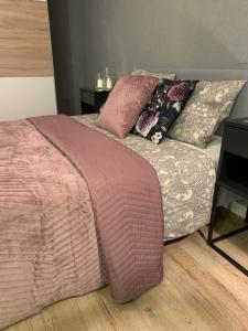 Posteľ alebo postele v izbe v ubytovaní Moderno Apartament