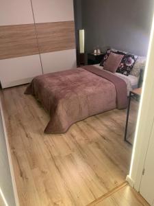 Posteľ alebo postele v izbe v ubytovaní Moderno Apartament