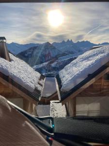 a view of the snow covered roofs of a mountain at Chalet Le Gebroulaz in La Toussuire