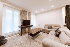 Televízia a/alebo spoločenská miestnosť v ubytovaní Apartamento San Marcial by SanSe Holidays
