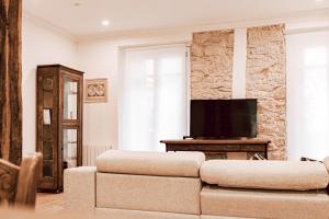 Televízia a/alebo spoločenská miestnosť v ubytovaní Apartamento San Marcial by SanSe Holidays