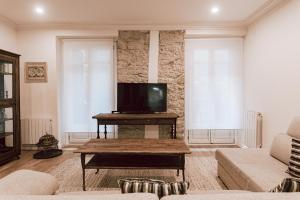 Televízia a/alebo spoločenská miestnosť v ubytovaní Apartamento San Marcial by SanSe Holidays