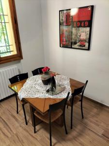 a dining room table with a table cloth on it at L'incanto home in Bologna