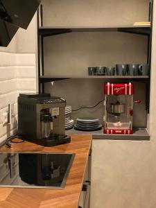 a kitchen with a coffee maker on a counter at Loft mit privater Sauna in Heidelberg