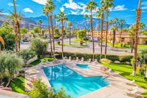 an aerial view of a resort with palm trees and a pool at TheBrio Palm Springs in Palm Springs