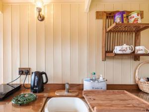 a kitchen with a sink and a counter top at The Nuthatch - Uk40297 in Martin