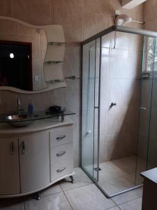 a bathroom with a shower and a sink at ROSA CORTIANA Escalera in São Gabriel