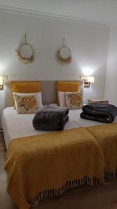 Uma cama ou camas num quarto em Meimoa Guesthouse