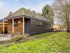 a small house with a brick at The Telephone Exchange in Codford Saint Mary