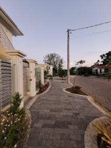 a cobblestone street in front of a house at Apartamento Residencial Villa di Vienna in Nova Petrópolis