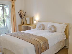 Ένα ή περισσότερα κρεβάτια σε δωμάτιο στο Sylvian Lodge