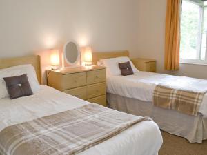 Ένα ή περισσότερα κρεβάτια σε δωμάτιο στο Sylvian Lodge