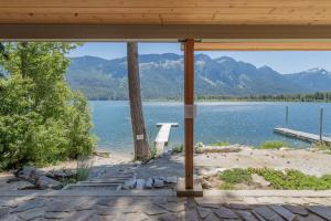 a view of a lake from the porch of a house at Lazy Bear Lodge by NW Comfy Cabins in Leavenworth