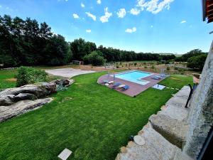 an aerial view of a yard with a swimming pool at Quinta da Abadia in Mangualde