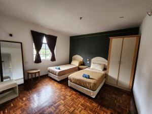 Little Star Hotel & Apartments tesisinde bir odada yatak veya yataklar