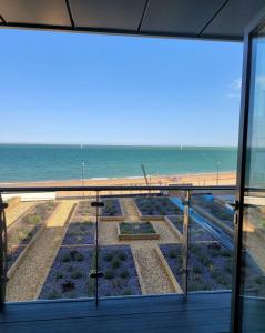 a view of the beach from a window at Royal View in Ramsgate