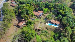 an aerial view of a house on a hill at Fazenda do Ingá in Cachoeira Paulista